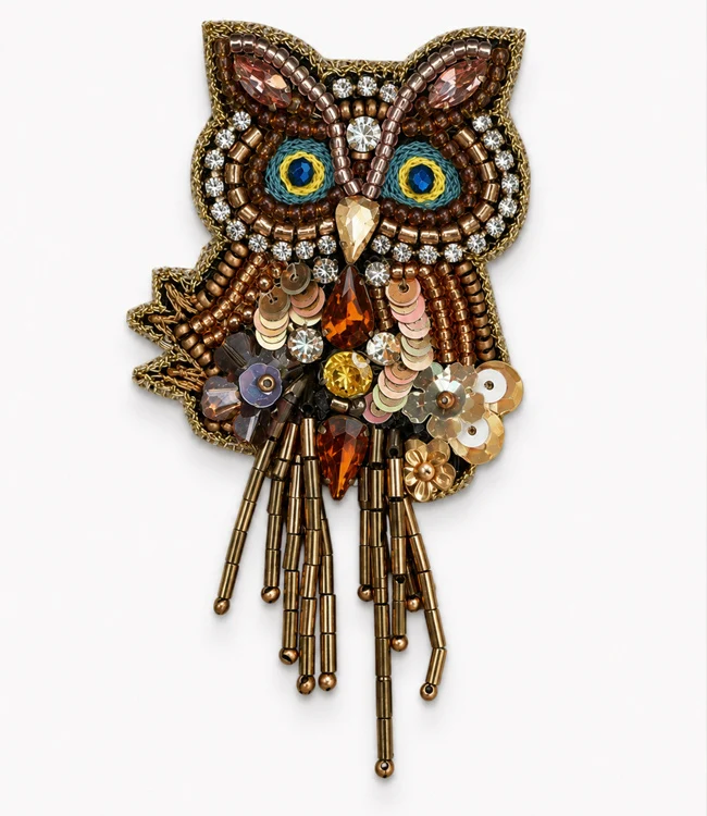 FAIRTRADE broche UIL met pailetten en kralen