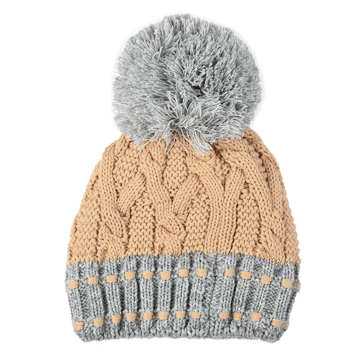 Dames kabelgebreide bobbelmuts met kleurcontrastdetails en grote garen pompon