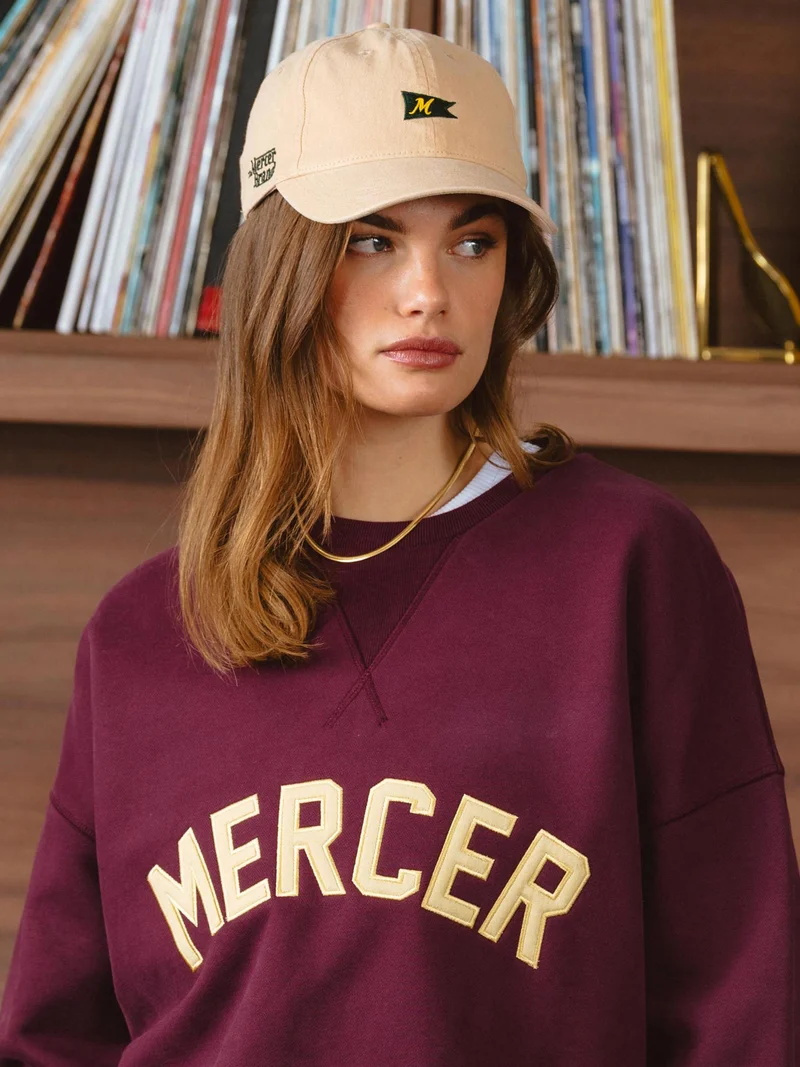 The mercer sweater met logo
